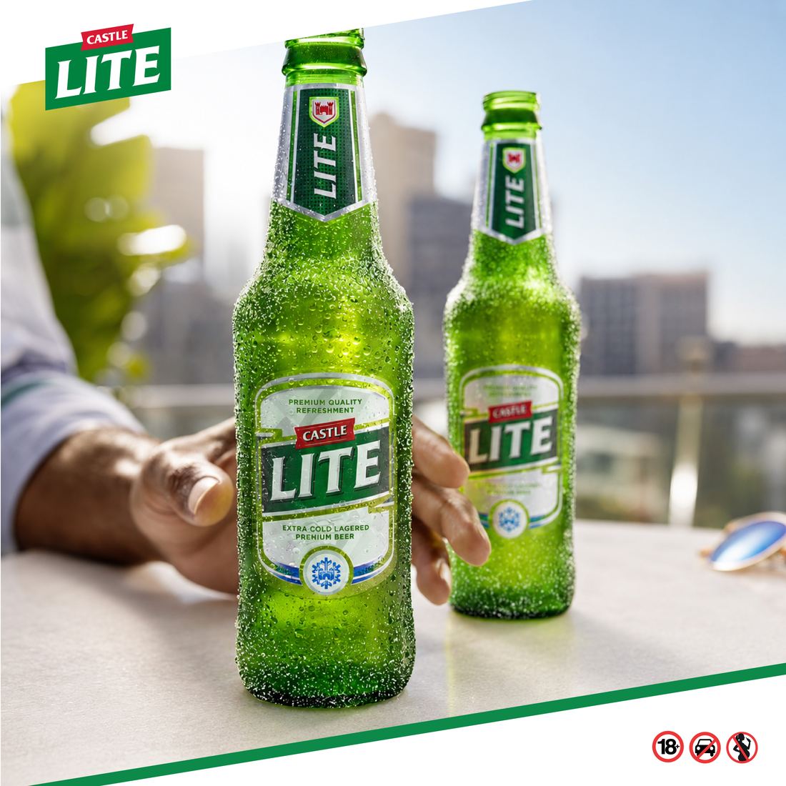 Two Castle Lite bottles on a balcony table